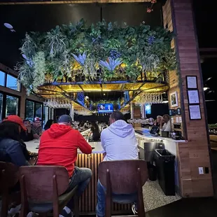 people sitting at a bar