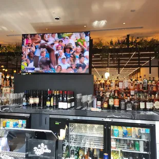 a bar with a large screen