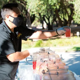 Agua Frescas. Staff wear masks and gloves.