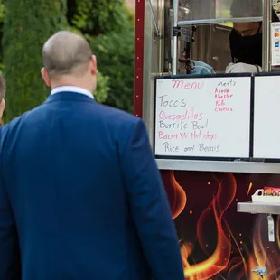 Ordering food at our wedding.