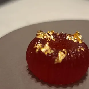 Gold flakes on gummy life saver
