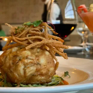 a plate of food and a glass of wine
