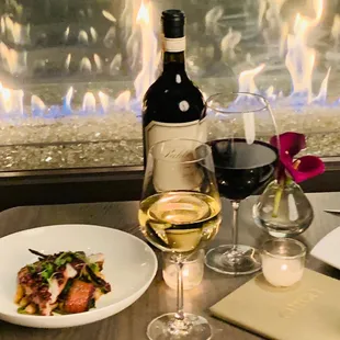 a glass of wine and a plate of food