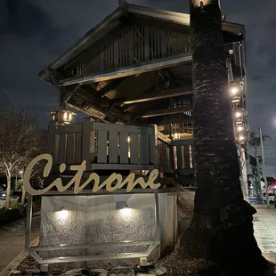 Front signage overlooked by large patio.