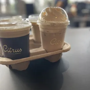 two cups of iced coffee on a tray