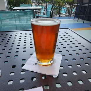 a glass of beer on a table