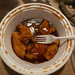 a bowl of food with a fork in it