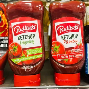 two ketchup bottles on a shelf