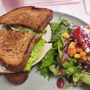 Hamd sandwich with side salad