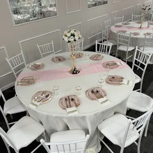Linen, runner and centerpiece (as well as setup) included in hall package. We added the place settings.