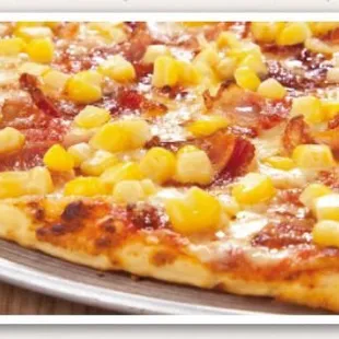 Think crust ham and corn pizza