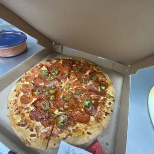 a pepperoni and jalapeno pizza