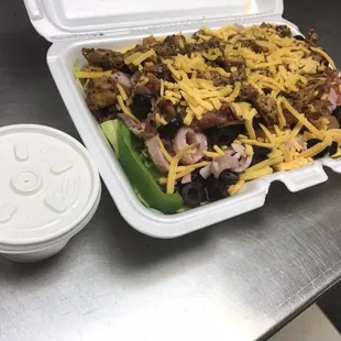 Citti&apos;s Supper Salad--grilled chicken, bacon, ham, black olives, lettuce, tomatoes, green pepper, carrots, topped with cheddar cheese