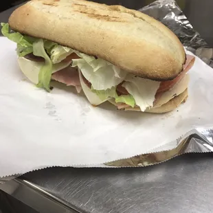 9inch Turkey and ham sandwich-- ham, turkey, lettuce tomatoes, onions and cheese