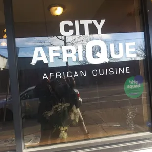 the reflection of a man in the window