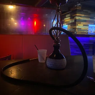 a hooket on a table in a bar