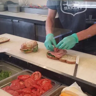 a man making a sandwich