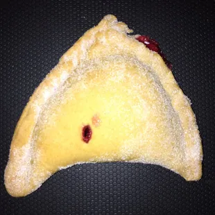 Strawberry empanada. I&apos;d guessed cherry but the clerk knew everything on the shelves and could tell me without even looking.
