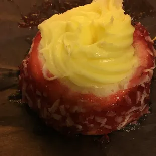 A little worse for wear packed at the bottom of the bag, this Bavarian creme filled cake is coated in strawberry and coconut.