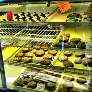 a variety of baked goods in a display case