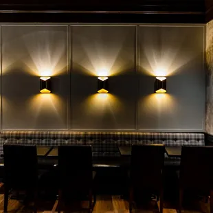 a table and chairs in a dimly lit room