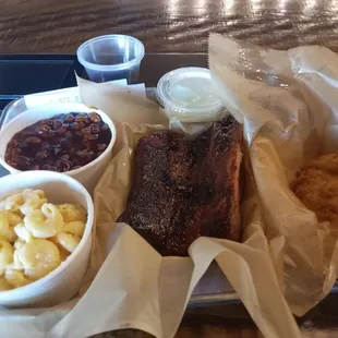 Ribs, chicken tenders, bbq beans and mac n cheese. Delicious!