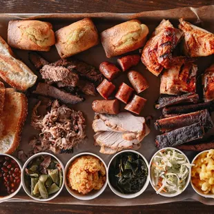 a platter of meats and sides