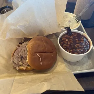 Pulled pork sandwich, potato salad and baked beans. Perfectly cooked pork. Not dry and super tender. Excellent job!