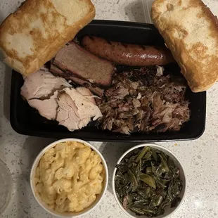 Sampler with Max n Cheese and Collared greens (with pork) and Texas toast! (Sausage, brisket, chicken, pork)