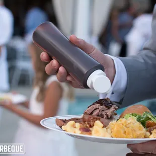 a man holding a plate of food