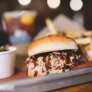 a pulled pork sandwich and fries