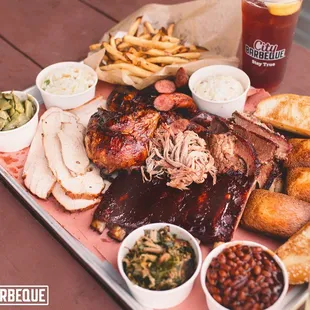 a barbecue platter with ribs and sides