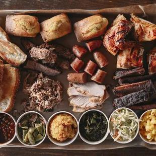 a platter of meat and sides