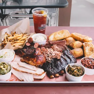 a platter of meat and sides