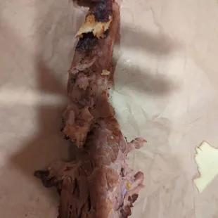 a piece of meat on a piece of paper