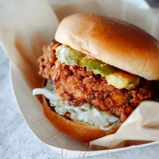 a chicken sandwich in a basket