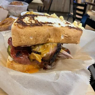 Carolina Goldmine: pulled pork, smoked beef sausage, crisp pickles, gold bbq sauce