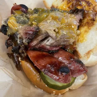 Carolina Goldmine sandwhich: pulled pork, smoked beef sausage, crisp pickles, gold bbq sauce