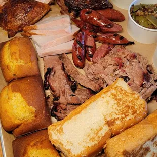 Platter of the .meats, with corn bread, garlic bread, and sides.
