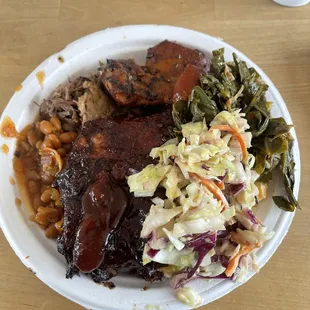 Smoked meats -brisket, short ribs, beans, collard greens, and coleslaw