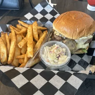 Fries and a burger. It&apos;s called the detroiter. It has a double patty fried egg lettuce and pickles. With a side of coleslaw.