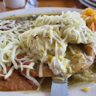 a plate of enchiladas and rice