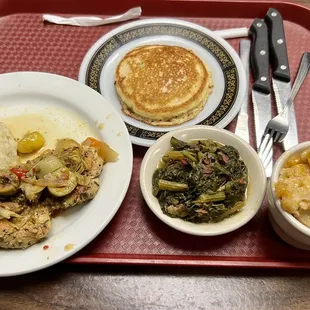 Chicken breast with mashed potatoes, greens, Mac n cheese and cornbread