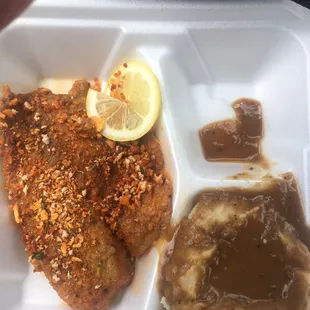 Baked tilapia (no flavorful seasoning) and mashed potatoes with gravy...