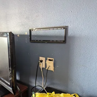 The cable plug was hanging out of the wall, TV wall mount left with no purpose