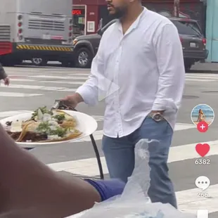 THIS GUY HARASSES STREET VENDORS BY SPRAYING THEM WITH WATER