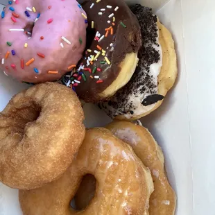 a variety of doughnuts in a box