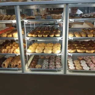 a display case full of doughnuts