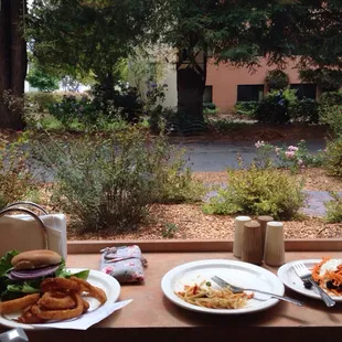 two plates of food on a window sill