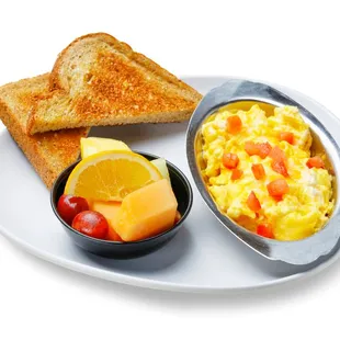 a plate of eggs, toast, and fruit